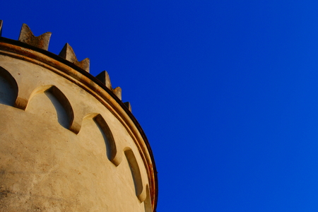 Detail of a tower with battlements and archesの写真素材