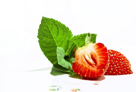 ripe red strawberries and green leafの写真素材