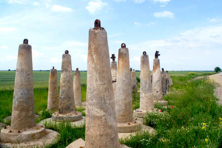 concrete pillars on the green fieldsの写真素材