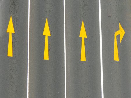 Direction arrows on a road from above.の写真素材