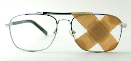 Eye glasses with a band-aid 