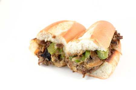 Messy philly cheese steak with mushrooms onions and peppersの写真素材