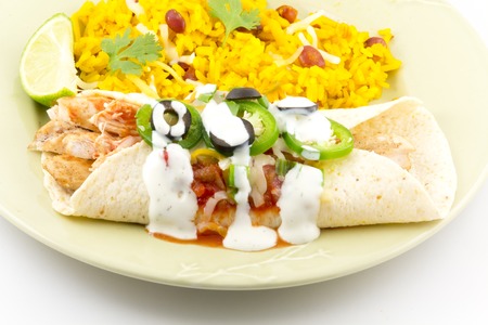 Heavenly enchilada with all the fixings begging to be eatenの写真素材