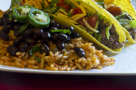 Mexican tacos with rice, black beans, and jalapenosの写真素材