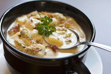 Creamy New England Clam Chowder garnished with parsleyの写真素材