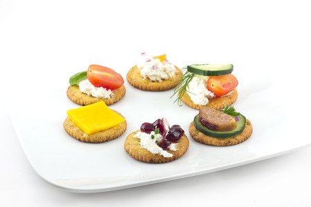 Assorted canopes, appetizer crackers with toppingsの写真素材