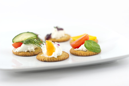 Assorted canopes, appetizer crackers with toppingsの写真素材