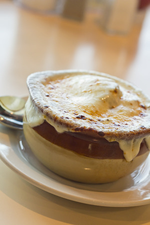 French onion soup with crispy gruyere cheese baked to perfectionの写真素材