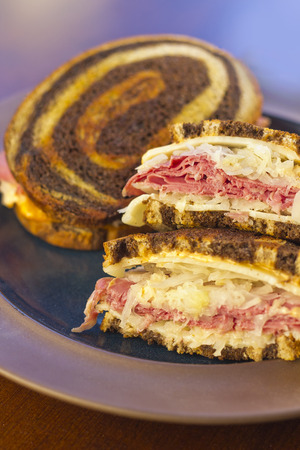 Famous New York Reuben corned beef sandwich with chips and a pickleの写真素材