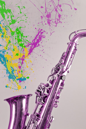 Saxophone plays a bunch of paint splatters to symbolize creative mindsの写真素材