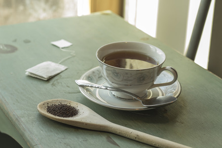 British black tea in a dainty tea cup and saucerの写真素材