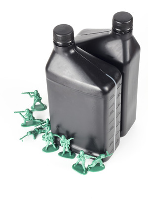 Toy army men with quart of oil symbolizing oil war in Middle Eastの写真素材