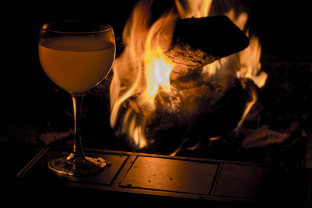 Wine glass by fire for winery adventure background imageの写真素材