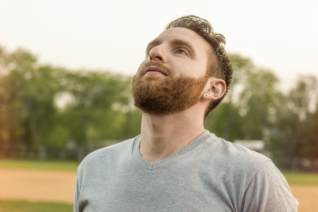 Portrait of bearded young man with gauged ears and stylish hairの写真素材