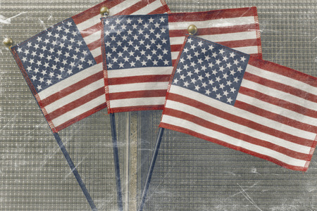 Waving three American flags in support the United States and freedomの写真素材