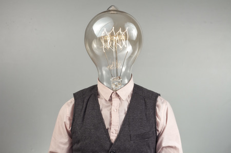Lighbulb head businessman for imagination themed background imageの写真素材