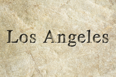 Engraving spelling the city Los Angeles on textured old surfaceの写真素材