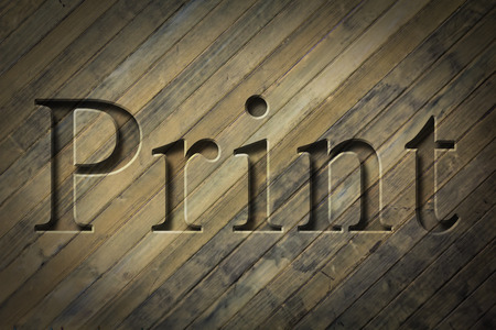 Engraving spelling the word Print on textured old surfaceの写真素材