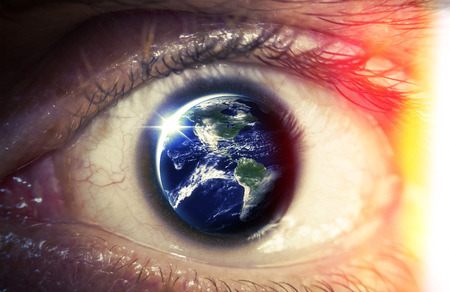Planet earth reflects in a macro close of a mans eye, Elements of photo furnished from NASAの写真素材