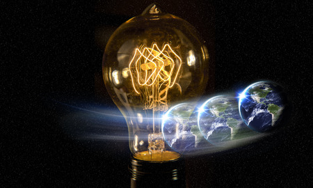Planet earth and lightbulb for global power and energy conceptの写真素材