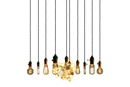 Decorative antique edison style light bulbs against brick wall background
