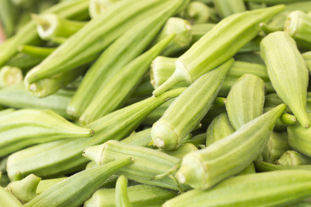 Pile of ripe okra for sale at local farmers marketの写真素材