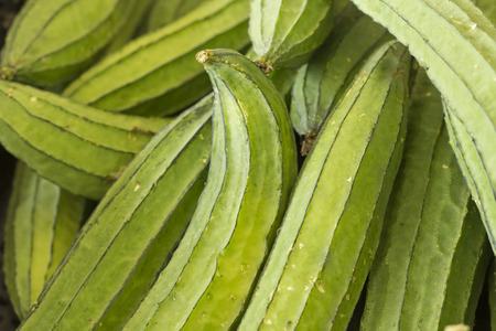 Pile of ripe okra for sale at local farmers marketの写真素材