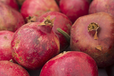 Fresh natural organic pomegranates on sale at local farmers marketの写真素材