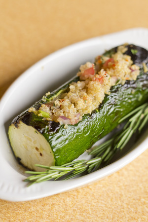 Grilled quinoa salad stuffed zucchini with rosemaryの写真素材