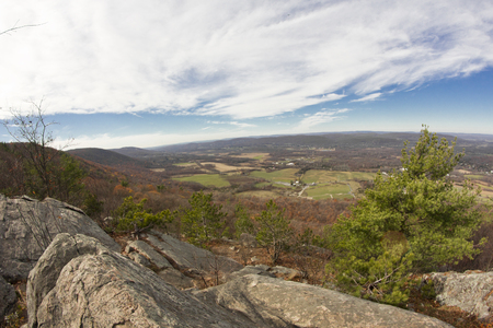 View from top of Appalachian Mountains with green pines and autumn maple and oak