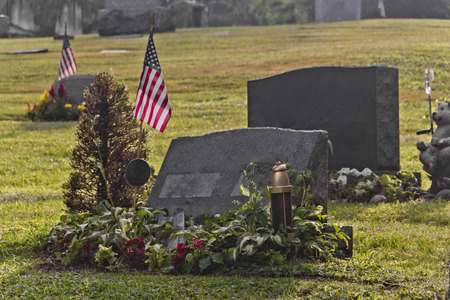 Blank graves in a graveyard in early morning