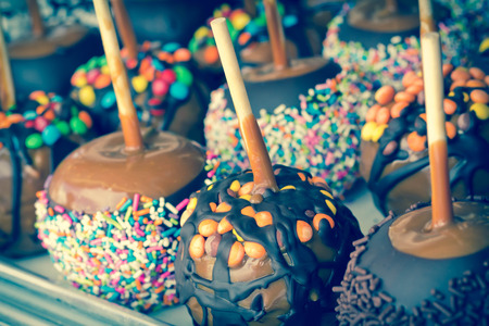 Tray of assorted variety of candy apples at state fairの写真素材