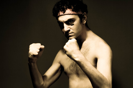 Very skinny headband wearing fighter shows skillsの写真素材