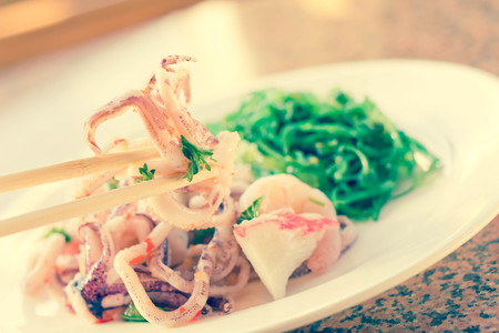 Lobster shrimp and calamari seafood salad with sesame seaweedの写真素材