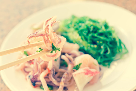 Lobster shrimp and calamari seafood salad with sesame seaweedの写真素材
