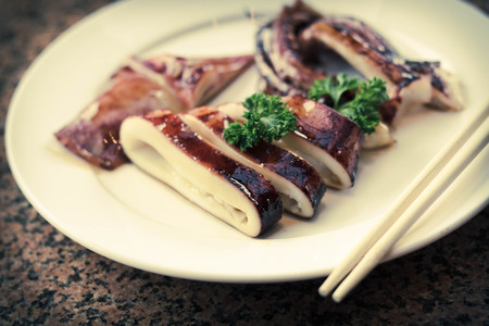 Marinated cooked squid calamari in sweet honey sauceの写真素材