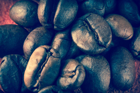 Close up pile of fresh aromatic coffee beans ready to brewの写真素材