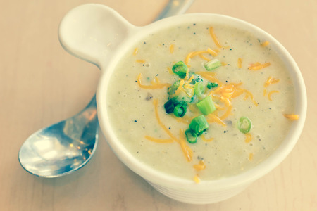 Steaming hot creamed potato broccoli and cheese soupの写真素材
