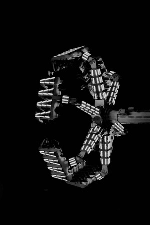 Carnival ride at night with glowing neon lightsの写真素材