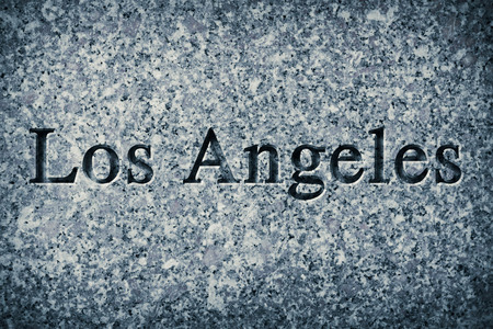 Engraving spelling the city Los Angeles on textured old surfaceの写真素材