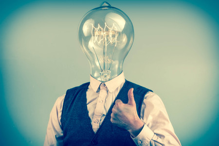 Lighbulb head businessman for imagination themed background imageの写真素材