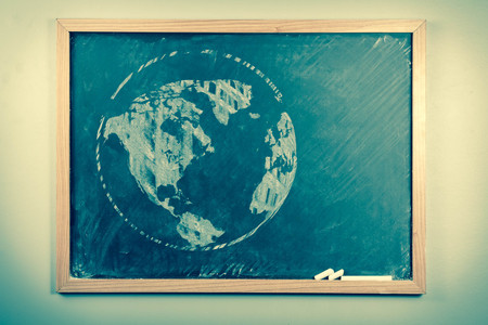 Chalkboard sketch drawing map of the world for education concept