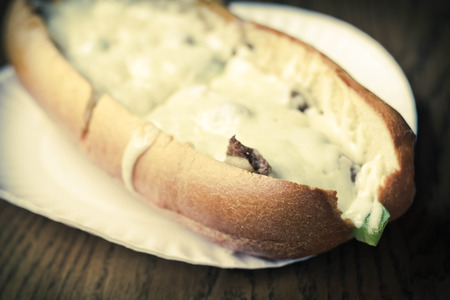 Philly Cheesesteak loaded with mozzarella cheese on submarine bunの写真素材