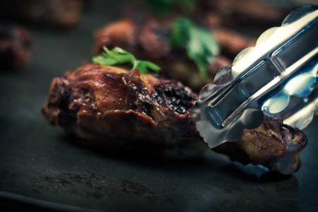 Pan with crispy and juicy grilled chicken drumsticksの写真素材