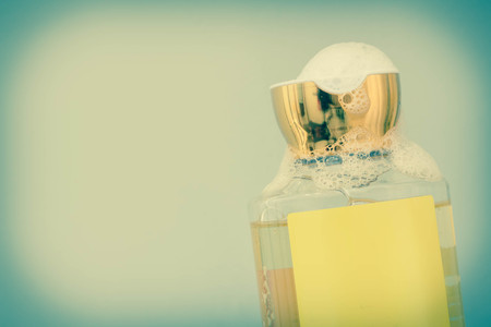 Liquid soap or shampoo dispenser with fun lathered soap sudsの写真素材