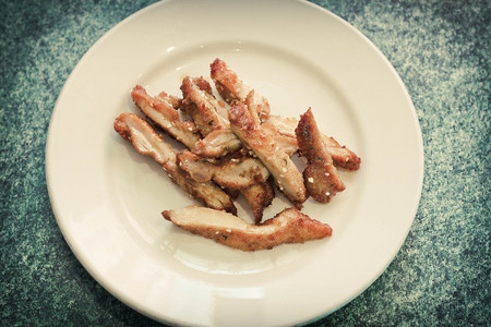 Chinese peanut crusted chicken breast with sesame seedsの写真素材