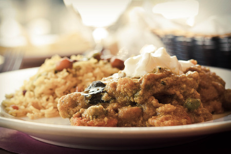 Authentic Indian vegetable Korma topped with yogurt sauce with a side of tamarind basmati rice and...