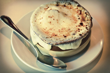French onion soup with crispy gruyere cheese baked to perfectionの写真素材