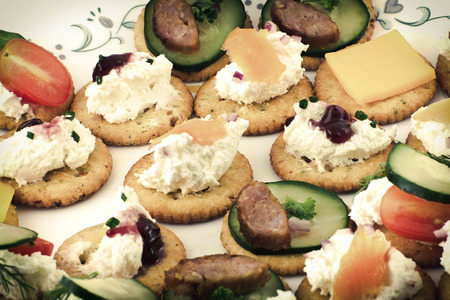 Assorted canopes, appetizer crackers with toppingsの写真素材
