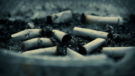 Cigarette butts in ash tray.